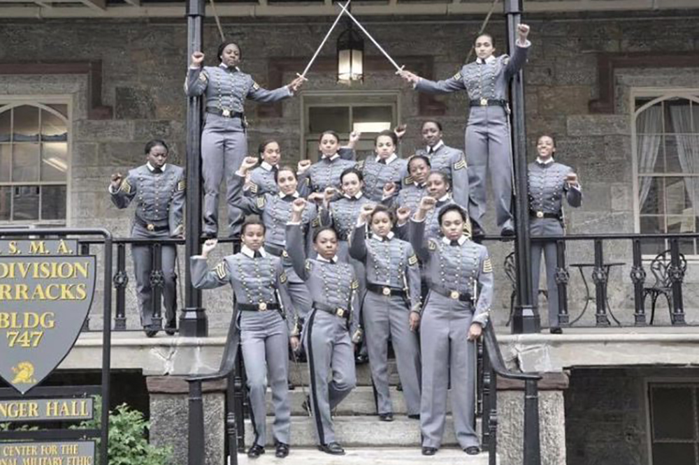 This undated image obtained from Twitter on Saturday, May 7, 2016 shows 16 black, female cadets in uniform with their fists raised while posing for a photograph at the United States Military Academy at West Point, N.Y. 