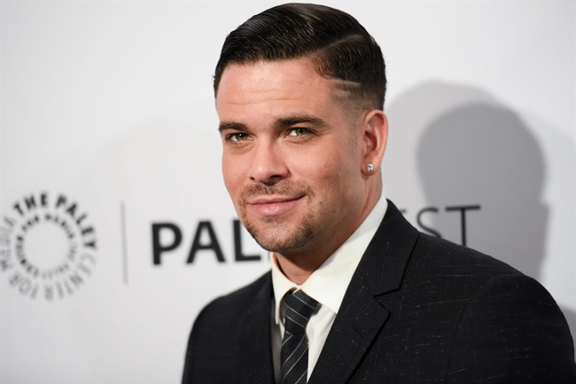 In this March 13, 2015 file photo, Mark Salling arrives at the 32nd Annual Paleyfest "Glee" held at The Dolby Theatre in Los Angeles. Salling, who played bad-boy Noah "Puck" Puckerman on the Fox musical dramedy "Glee," was charged Friday, May 27, 2016, with receiving and possessing child pornography.