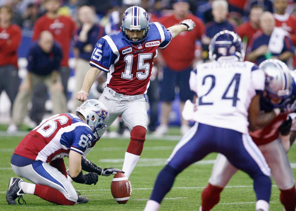 Montreal Alouettes slotback Ben Cahoon holds the ball for kicker Damon Duval during action against the Toronto Argonauts during the first quarter of the CFL Eastern Final Sunday November 21, 2010 in Montreal.