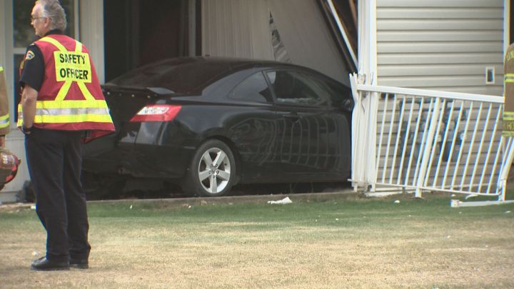 A car crashed into a condo's patio in southwest Edmonton on May 18, 2016.