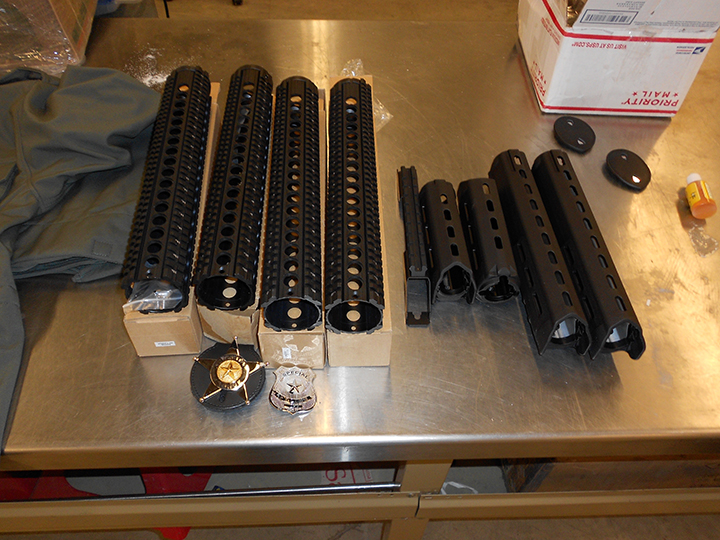 Border officials seized handgun and rifle parts seen in this handout photo in a shipment headed to Iraq.