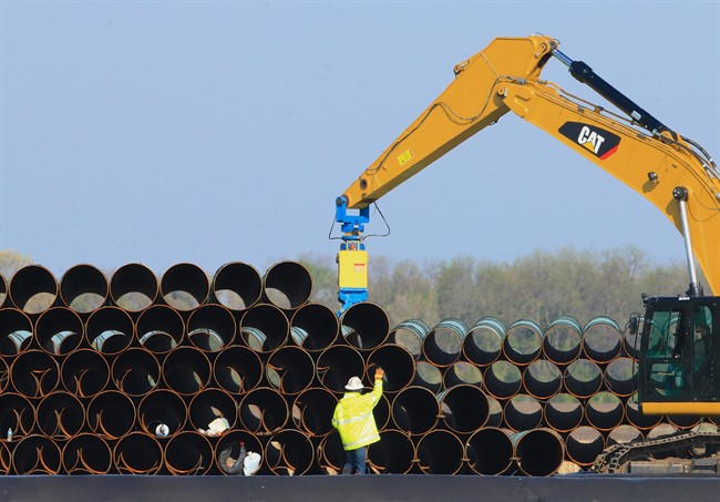 FILE – In this May 9, 2015 file photo, pipes for the proposed Dakota Access oil pipeline that will stretch from the Bakken oil fields in North Dakota to Illinois are stacked at a staging area in Worthing, S.D.