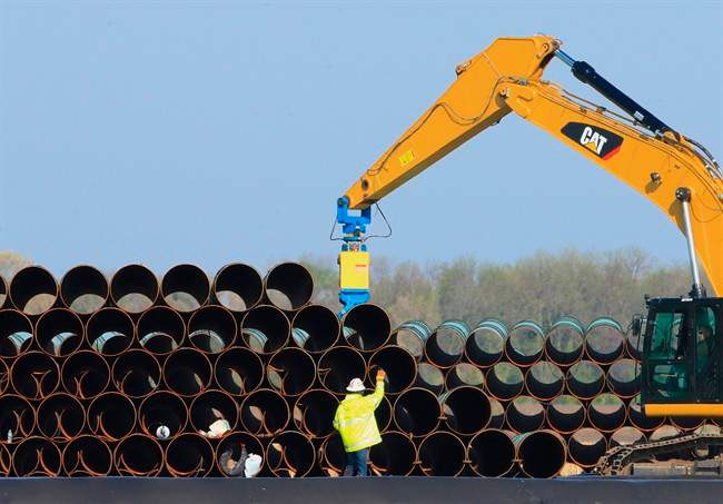 FILE - In this May 9, 2015 file photo, pipes for the proposed Dakota Access oil pipeline that will stretch from the Bakken oil fields in North Dakota to Illinois are stacked at a staging area in Worthing, S.D. 