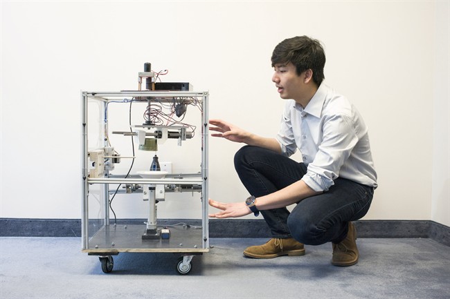 Richard Yim is pictured in Toronto on Monday, May 2, 2016, with the second prototype of a robot that can safely defuse landmines. Yim, a University of Waterloo student who grew up in Cambodia where many fear hidden landmines, is part of a team which recently won the Waterloo Velocity Fund Challenge and received funding from the Canadian Landmine Foundation. THE CANADIAN PRESS/Chris Young.
