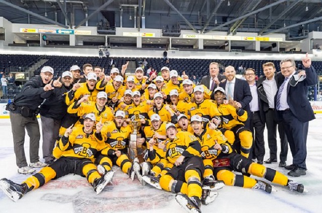 The Brandon Wheat Kings pose with the Ed Chynoweth Cup after winning their first WHL title in 20 years.