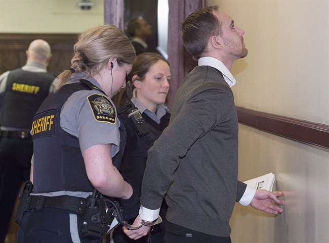 William Sandeson has his handcuffs removed as he arrives at his preliminary hearing at provincial court in Halifax in a February 23, 2016, file photo. THE CANADIAN PRESS/Andrew Vaughan.