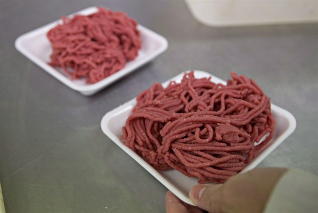 Fresh ground beef is packed at a local butcher shop in Levis Que. 