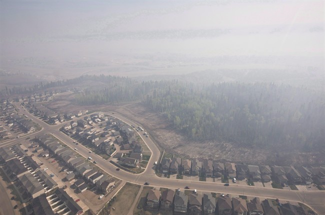 Smoke fills the sky from wildfires over Fort McMurray, Alta., on May 13, 2016.