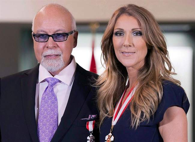 Celine Dion, right, and late husband René Angélil posing for photos after being decorated with the Order of Canada in Quebec City in July 26, 2013.