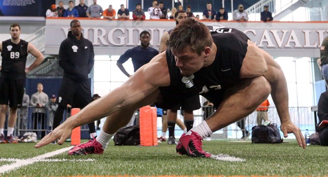 Virginia's Trent Corney reaches the line on a shuttle run during March's NFL football pro day.