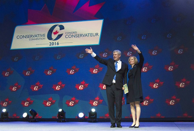 Former prime minister Stephen Harper and his wife Laureen wave to the crowd at the Conservative Party of Canada convention in Vancouver, Thursday, May 26, 2016. 