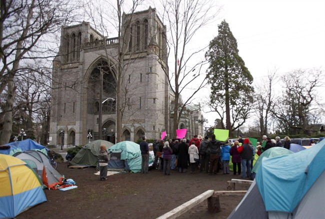 FILE - People at the homeless camp are vowing to stay despite the B.C. government's offer of alternate shelter as people speak to media about their concerns in Victoria in a January 11, 2015, file photo. 