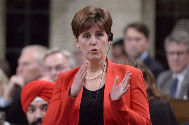 International Development Minister Marie-Claude Bibeau responds during Question Period in Ottawa in a December 9, 2015, file photo.
