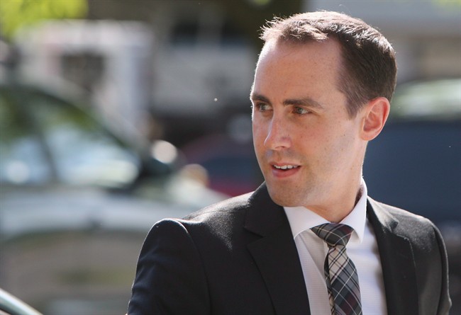 Defendant Michael Sona walks to the courthouse in Guelph, Ont., on June 4, 2014. The case of a former Conservative staffer convicted in the 2011 federal election robocalls scandal is going before Ontario's highest court this week.