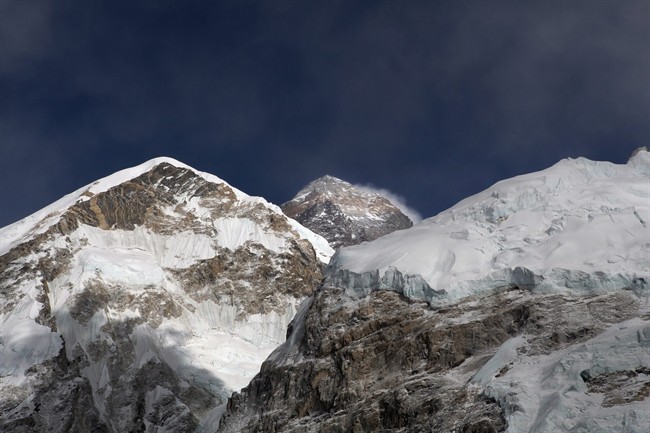 Mount Everest, in middle, altitude 8,848 meters (29,028 feet), is seen on the way to base camp.