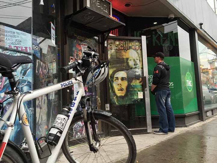 A police bicycle is seen outside of the Toronto Holistic Cannabinoids Dispensary in Kensington Market on May 26, 2015.