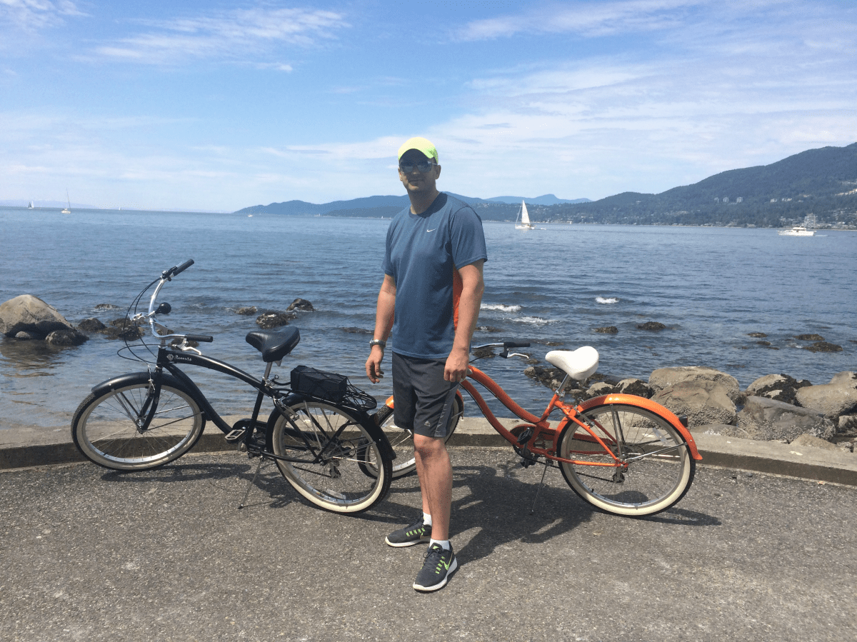 Emil Nowoszewski standing next to his bike (the black one on the left), just an hour before it was stolen in Coal Harbour on May 14, 2016.