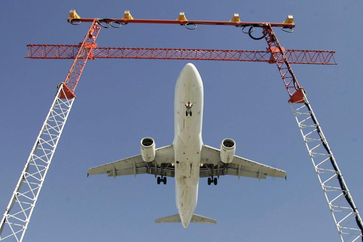 An Air Canada flight makes its final approach as it lands at Pearson International Airport in Toronto on Sept. 30, 2004. 