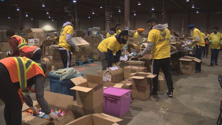 Volunteers sort through items at the EERSS drop-off site in Edmonton Sunday, May 22, 2016.