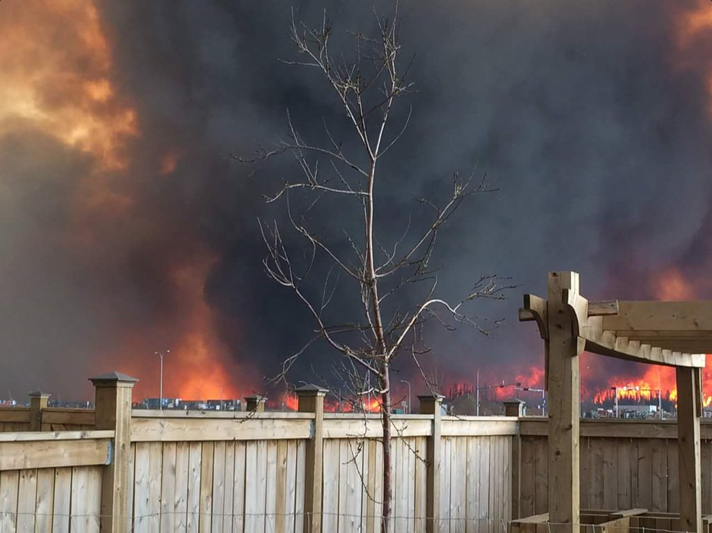 A view of the wildfire from the backyard of Lacey and Dennis Bowie's home. The Nova Scotia couple, now living in Fort McMurray, fled the city on Tuesday. 