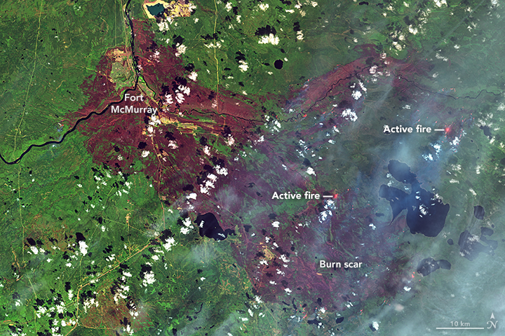 False-colour satellite images show burn scars in and around Fort McMurray after wildfires ravaged the region last week.