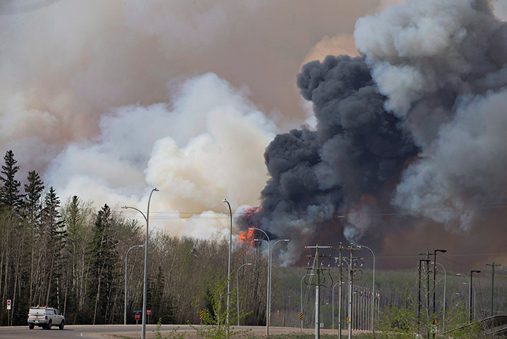 A wildfire rages through Fort McMurray Alta, on Wednesday May 4, 2016.