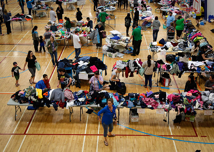Evacuees from the Fort McMurray wildfires collect donated necessities at the evacuation centre in Lac La Biche, Alta., Thursday, May 5, 2016.