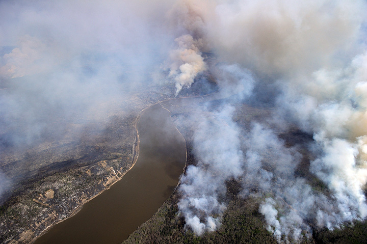 An aerial view of the wildfires in the Fort McMurray area is seen from a CH-146 Griffon on May 4, 2016.