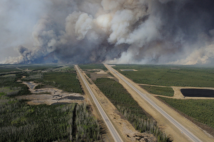 An aerial view of the wildfires in the Fort McMurray area is seen from a CH-146 Griffon on May 4, 2016.