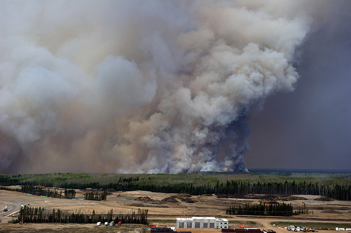 An aerial view of the wildfires in the Fort McMurray area is seen from a CH-146 Griffon on May 4, 2016.