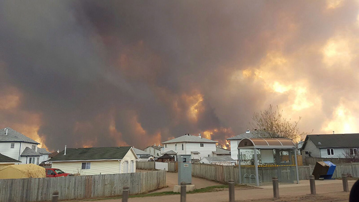 A wall of fire rages outside of Fort McMurray, Alta. Tuesday May 3, 2016.