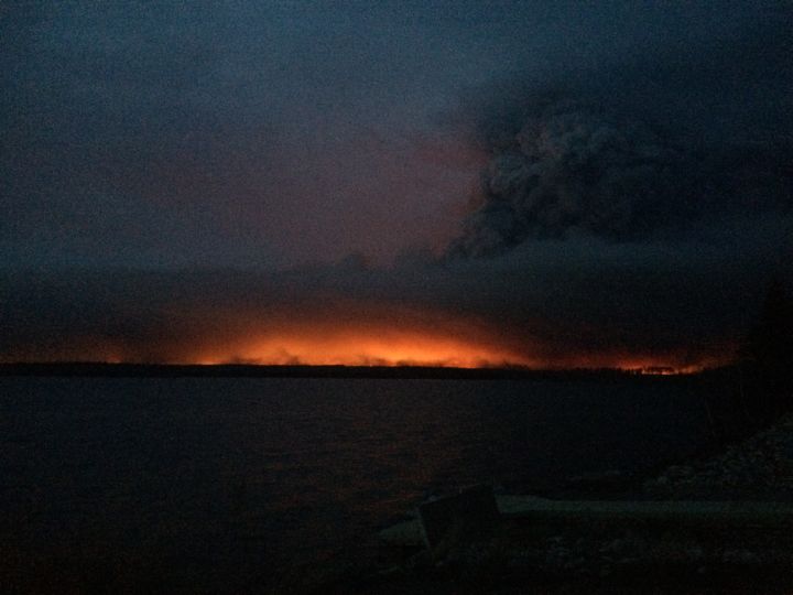 A fiery scene over Gregoire Lake as flames and smoke from a wildfire hang over Fort McMurray on Wednesday, May 4, 2016.