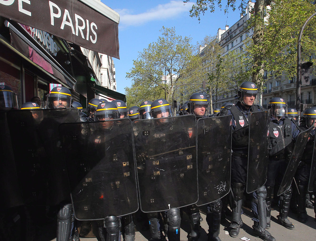 Riot police take positions as part of the traditional May Day march in Paris, France, Sunday, May 1, 2016.