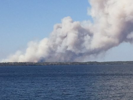 100 people evacuated as firefighters battle forest fire along Manitoba ...