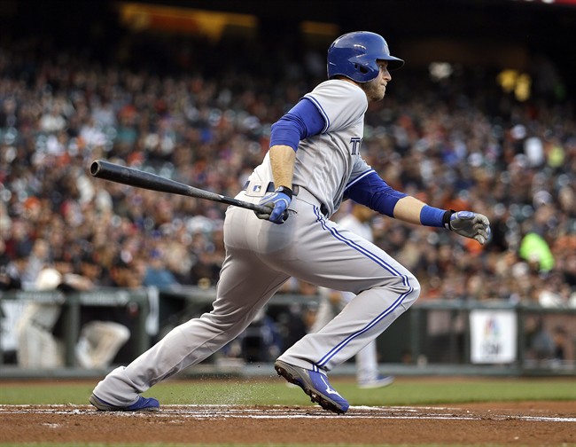 Toronto Blue Jays' Michael Saunders follows through on his swing after hitting an RBI single off San Francisco Giants pitcher Jake Peavy in the first inning of a baseball game Monday, May 9, 2016, in San Francisco. 