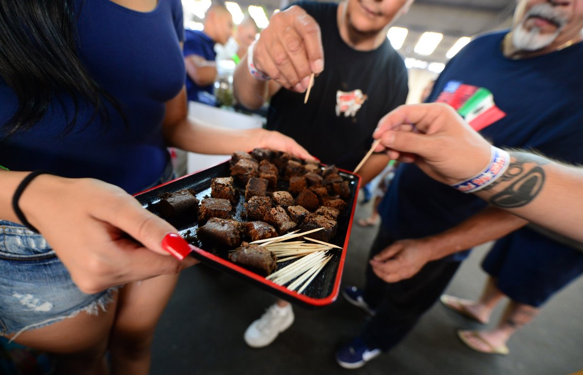 Care-carrying medical marijuana patients sample the brownies at Los Angeles' first-ever cannabis farmer's market at the West Coast Collective medical marijuana dispensary, in Los Angeles, California on July 4, 2014.