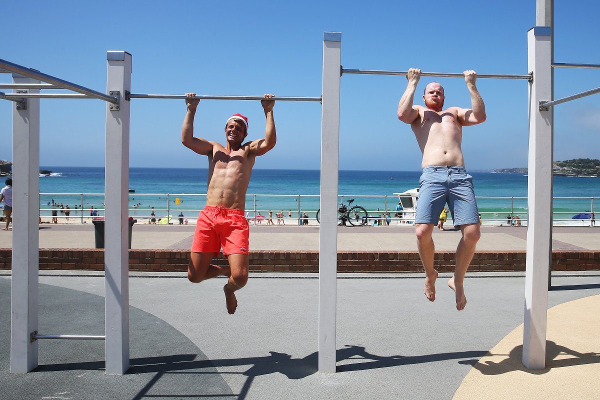 Kasper Troltoft from Sweden and Blake McClean from Bondi work out at the outdoor public gym at Bondi Beach.