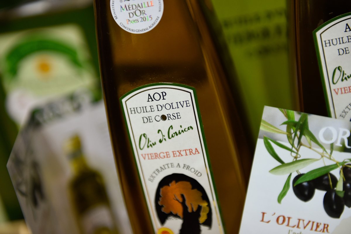 A picture taken on February 26, 2015 shows a bottle of Corsica's AOP or PDO (Protected Designation of Origin) olive oil during the Paris international agricultural fair at the Porte de Versailles exhibition center in Paris.