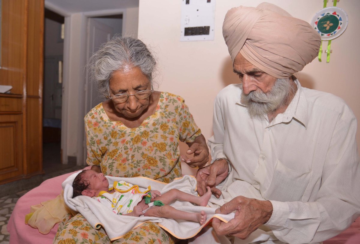 Indian parents Mohinder Singh Gill (L), 79, and Daljinder Kaur, 70, pose for a photograph as they hold their newborn baby boy Arman at their home in Amritsar on May 11, 2016.
The new mother said her life was now complete. 