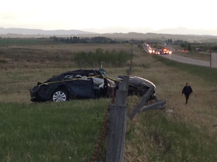 Two people were taken to hospital Thursday, May 26, 2016 after a rollover on the Trans-Canada Highway west of Calgary.