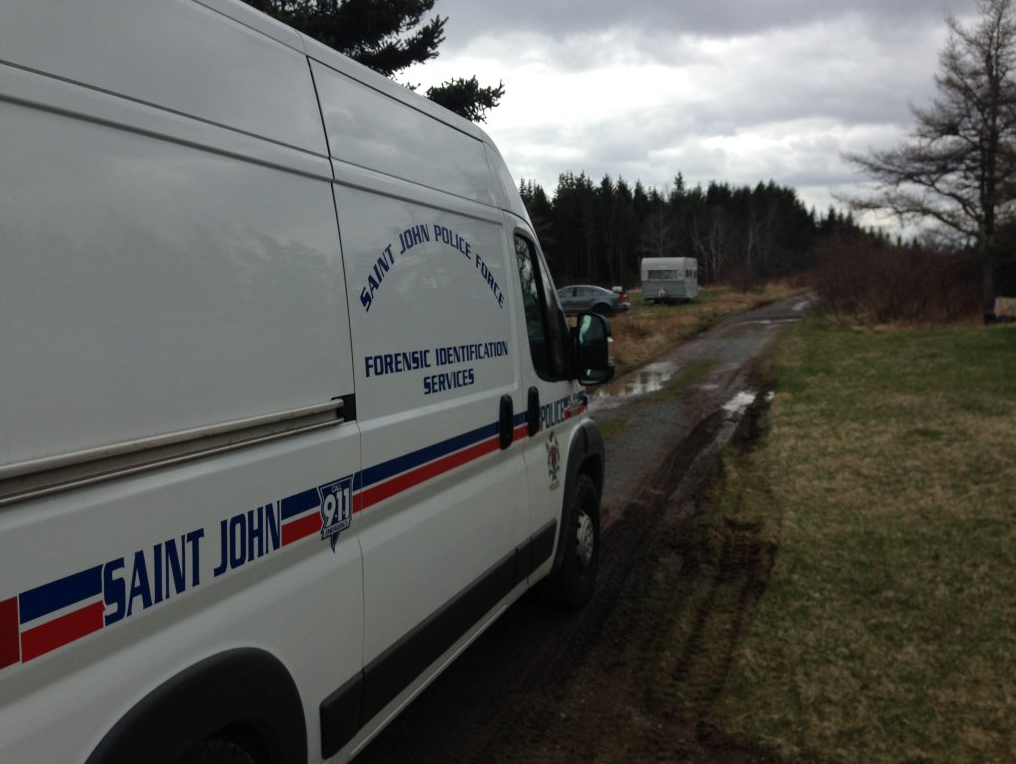 Police on the scene of possible human remains found in Saint John on Monday May 9, 2016. 