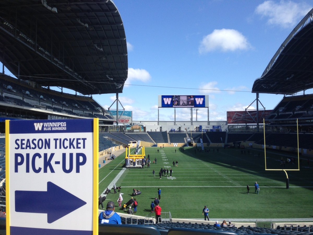 Winnipeg Blue Bombers fans participate in on-field drills at Fan Fest. 