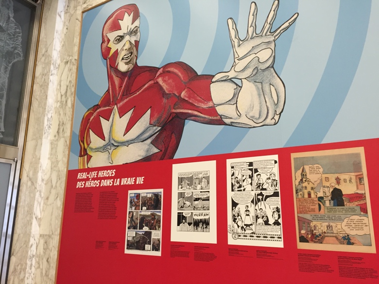The walls of the lobby at Library and Archives Canada are plastered with superheroes starting this week.