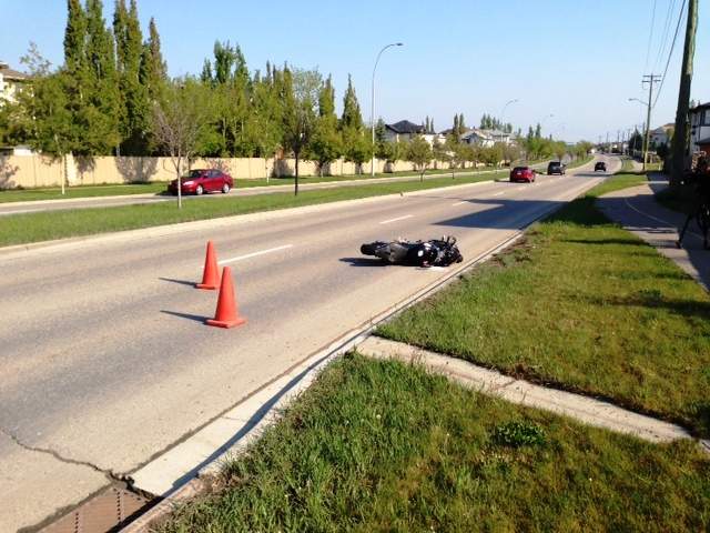 Emergency crews respond to a motorcycle crash on Chaparral Boulevard S.E. near Chaparral Ravine Way S.E. on Friday, May 13, 2016.