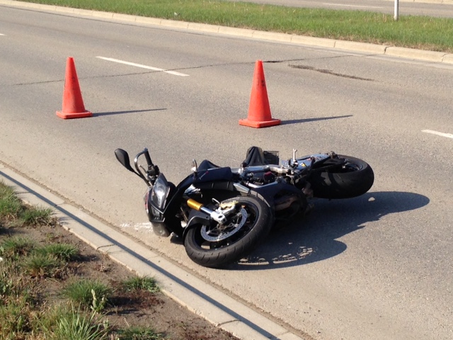 Emergency crews respond to a motorcycle crash on Chaparral Boulevard S.E. near Chaparral Ravine Way S.E. on Friday, May 13, 2016.