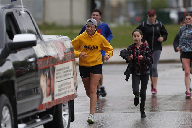 Kayleen McKay arrives with students from West Kildonan at the Alexander Docks in Winnipeg on Tuesday.