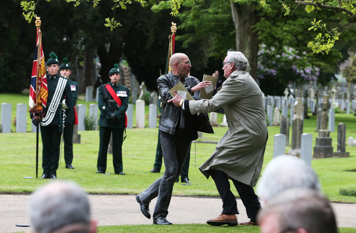 Canadian Ambassador to Ireland Kevin Vickers, right, wrestles with a protester during a State ceremony