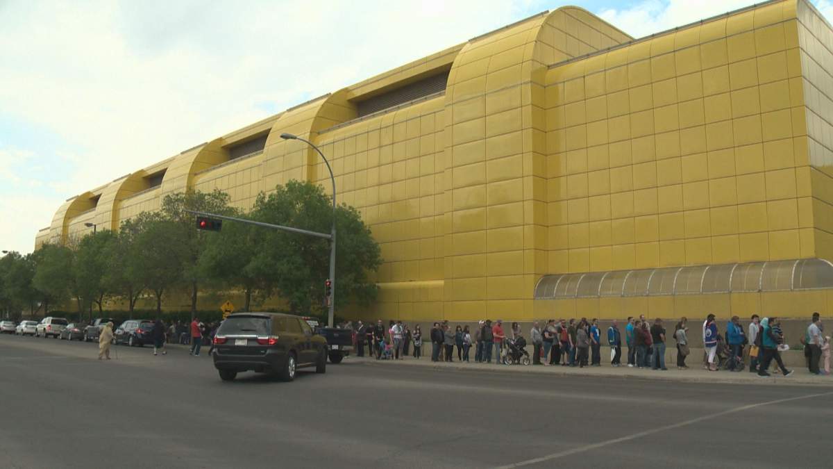 Those displaced by the Fort McMurray wildfire line up outside Edmonton’s Butterdome for government cash cards, May 11, 2016.