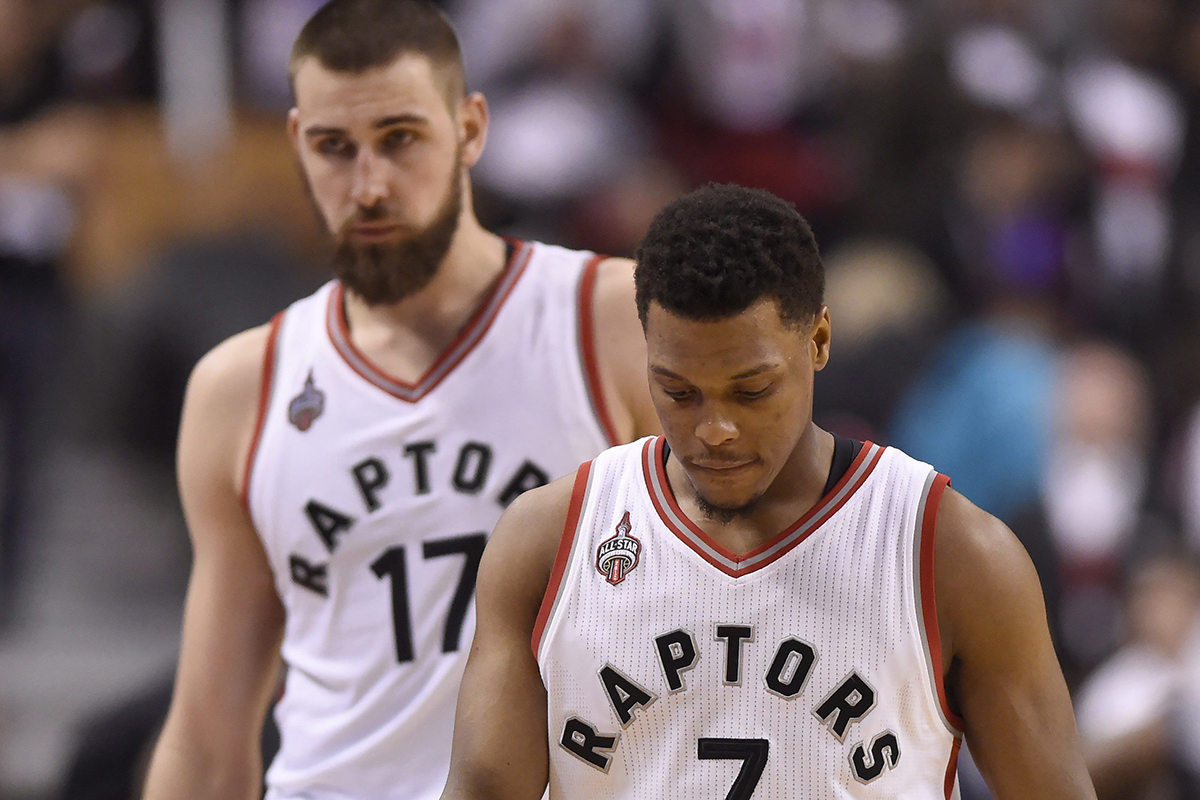 Kyle Lowry and Jonas Valanciunas walk towards the bench late in regulation time game one second round NBA playoff basketball action against the Miami Heat.