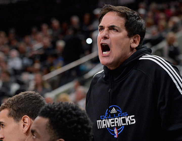 Dallas Mavericks owner Mark Cuban yells at an official during the second half of an NBA basketball game against the San Antonio Spurs, Sunday, Jan. 17, 2016, in San Antonio. 